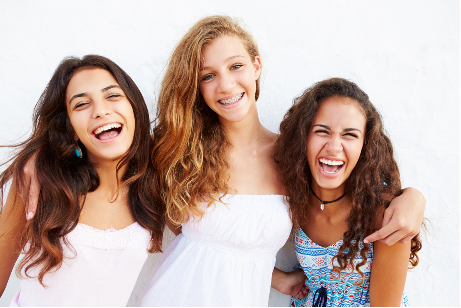 A group of girls smiling, Fastbraces®: Revolutionizing Orthodontics