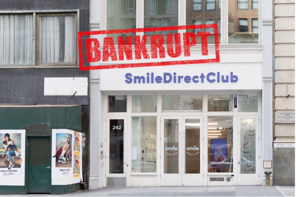 A close-up of Smile Direct Club and bankruptcy sign.